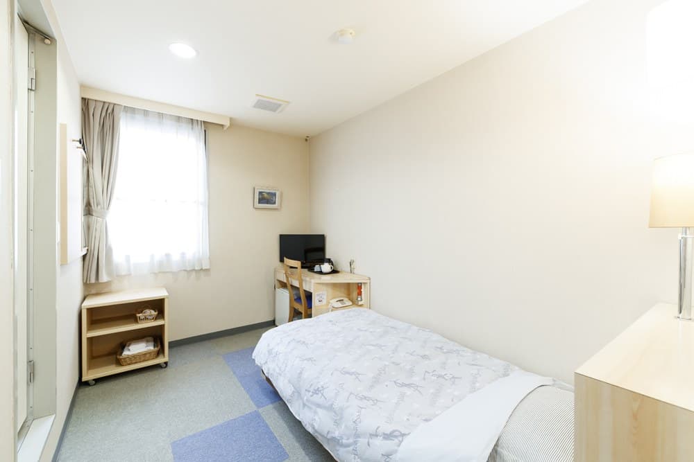 Western rooms with beds and desks