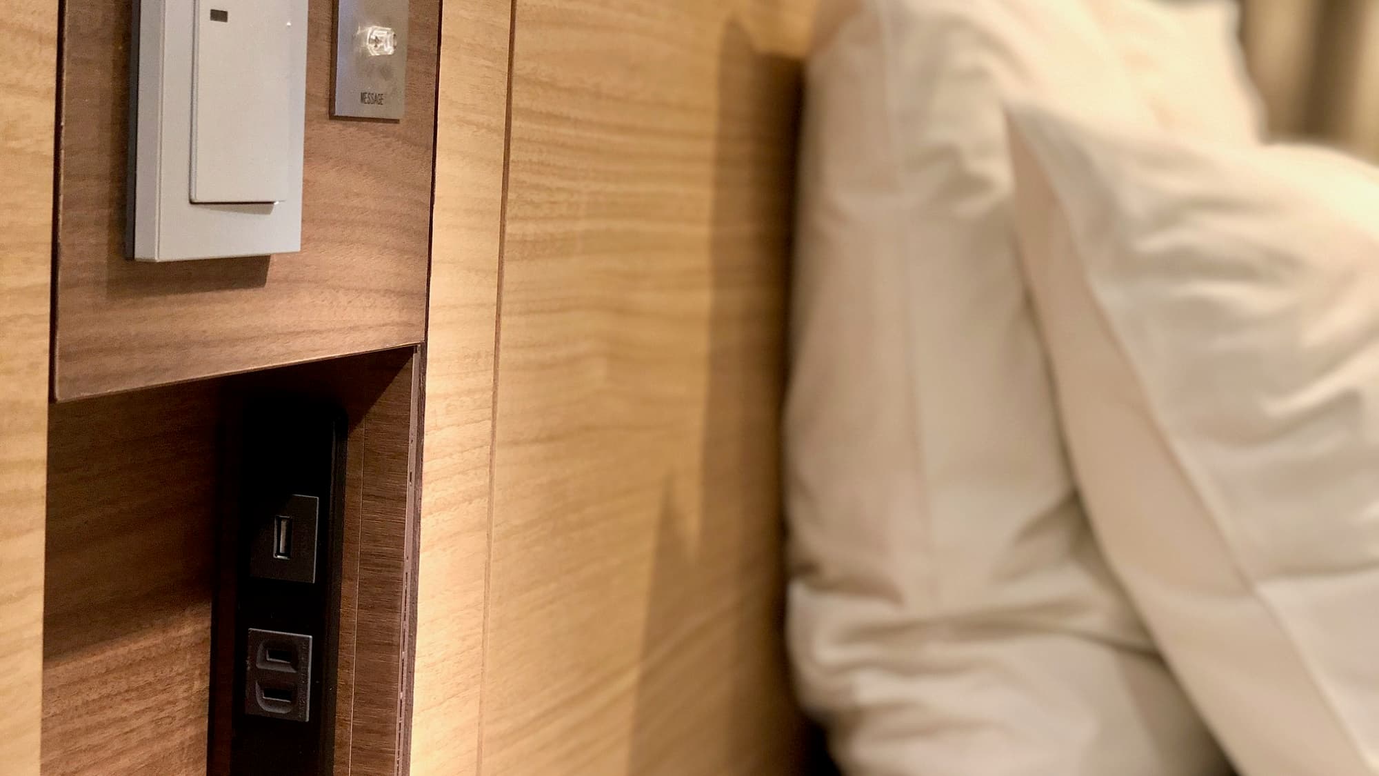 There is a USB outlet at the bedside.