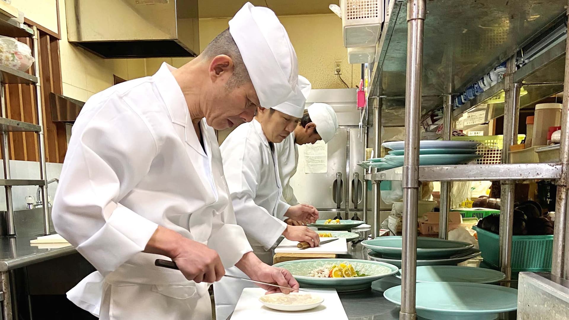 [Cooking scene] Our chefs carefully prepare each dish.