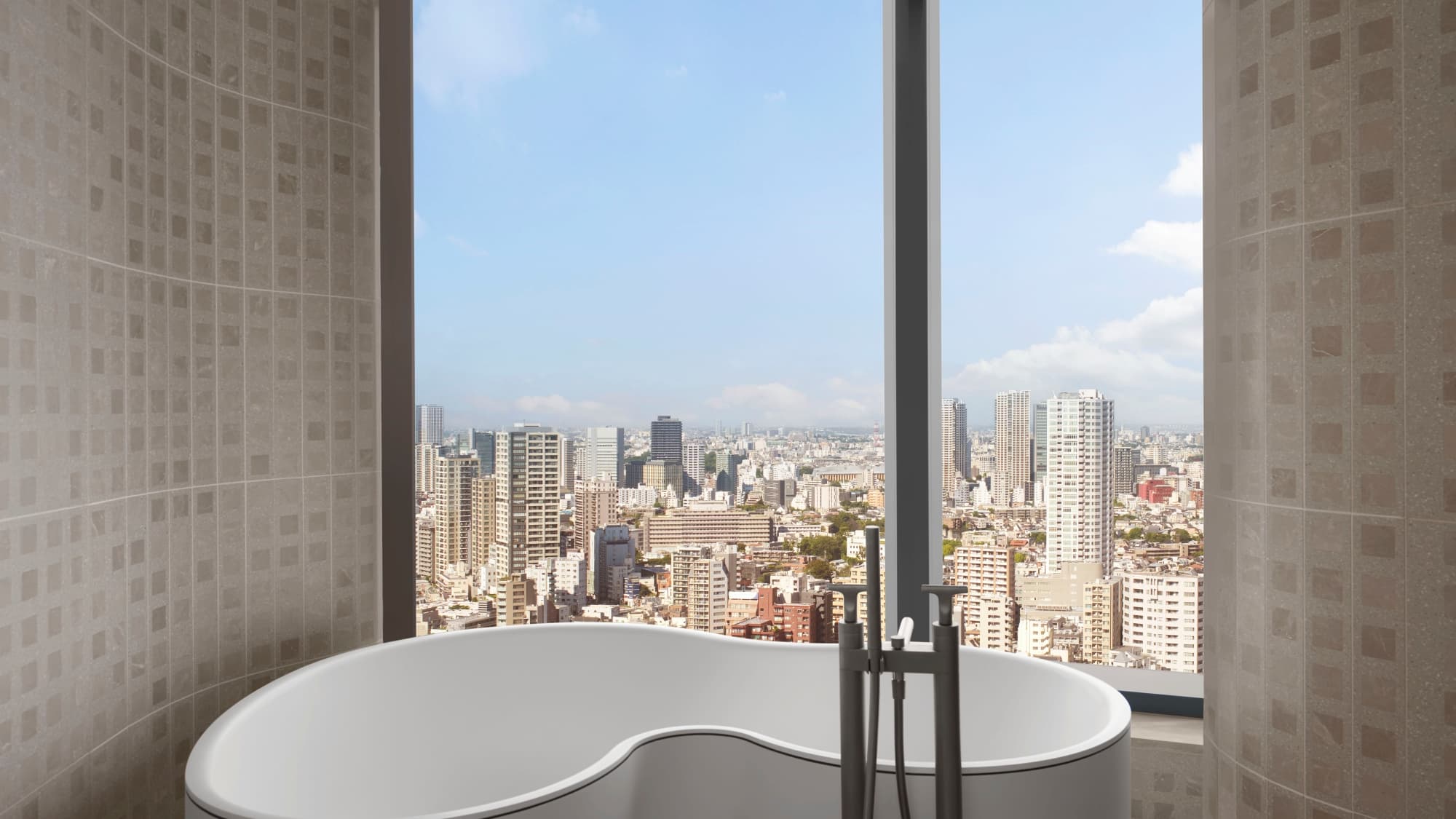 [Executive Suite/Bathroom] Enjoy a luxurious bath time with a panoramic view of Tokyo's cityscape.