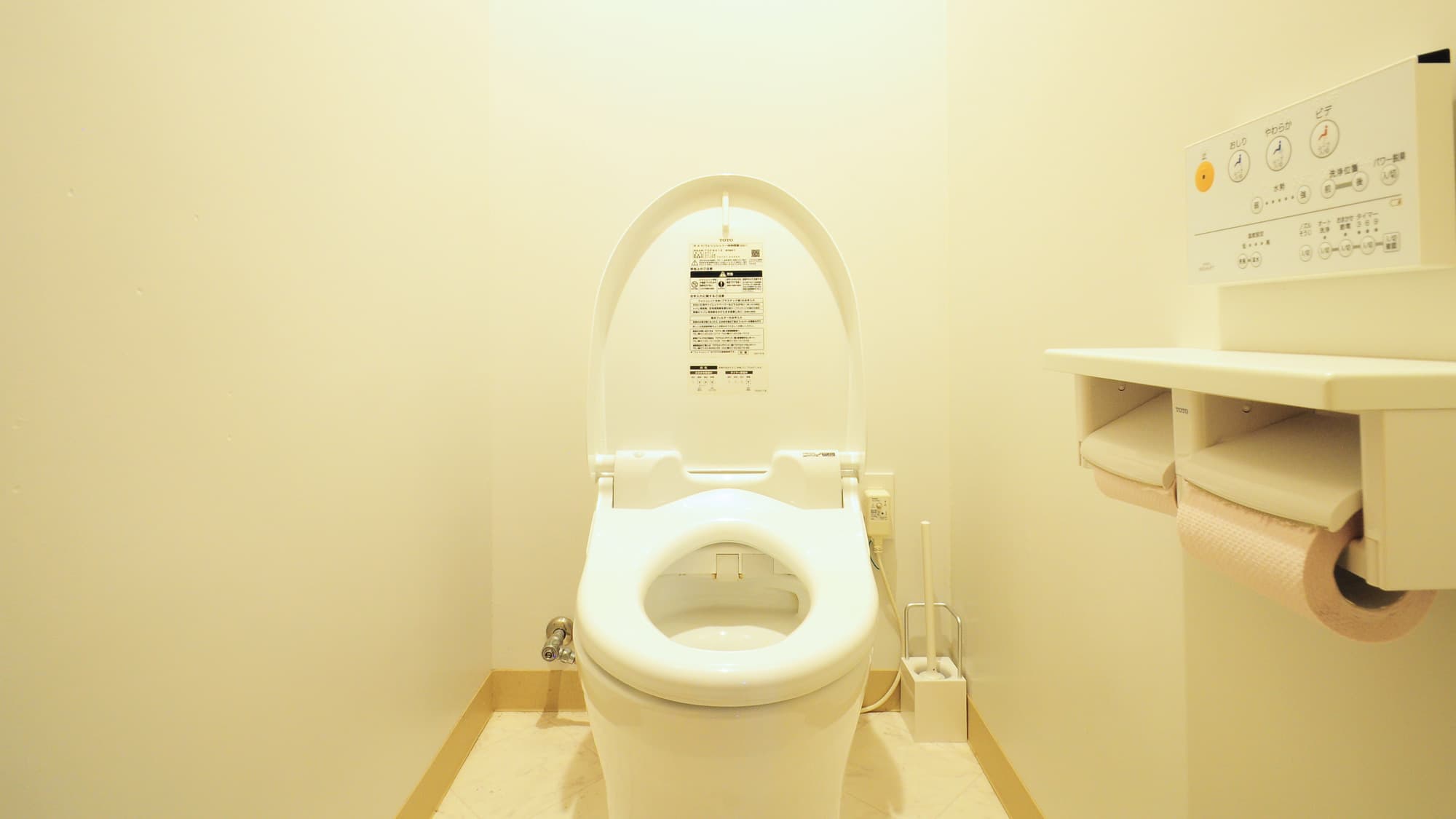 [Toilet] Located in the room behind the kitchen.