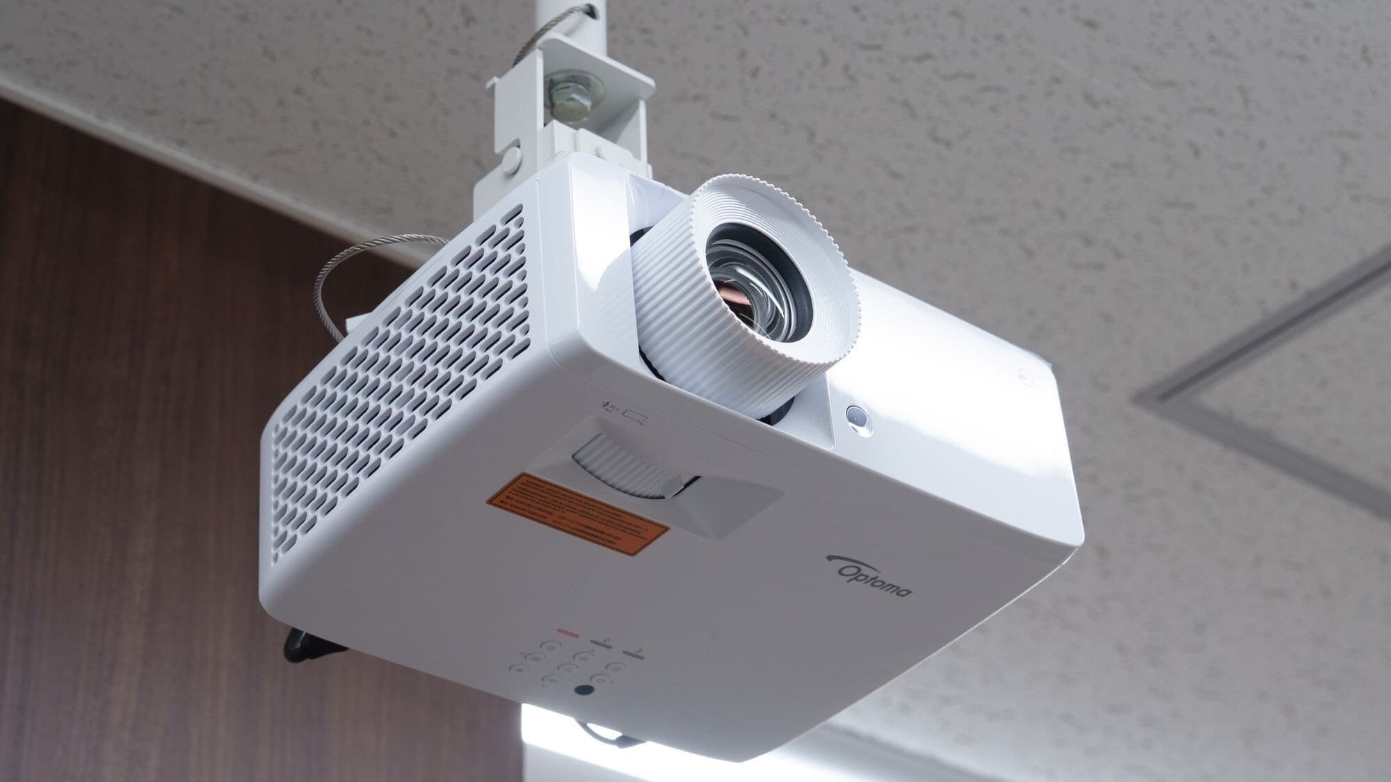 The meeting room is equipped with a projector and a whiteboard.