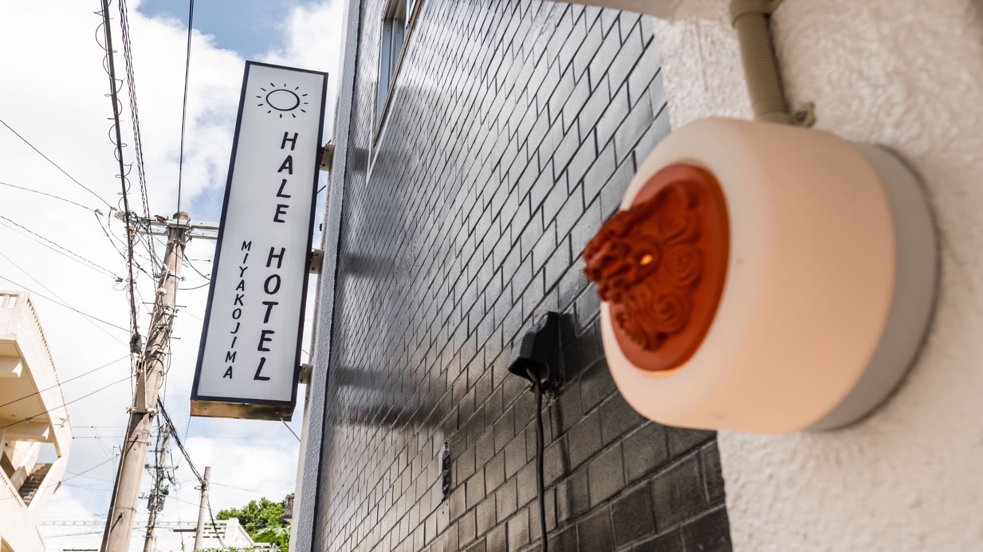 [Exterior] Look for the hotel logo and Shisa statues. We warmly welcome you to our bright and clean entrance.