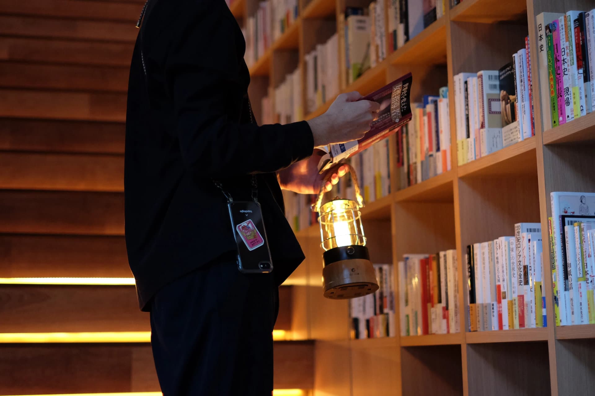 [Bookstore at night] The stairs leading to the second floor are lined with books
