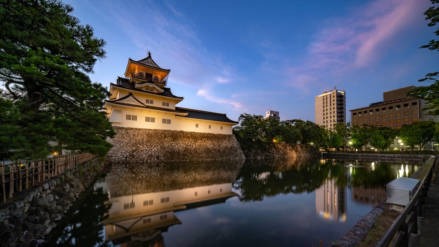 You can see the Super Hotel over Toyama Castle at night.