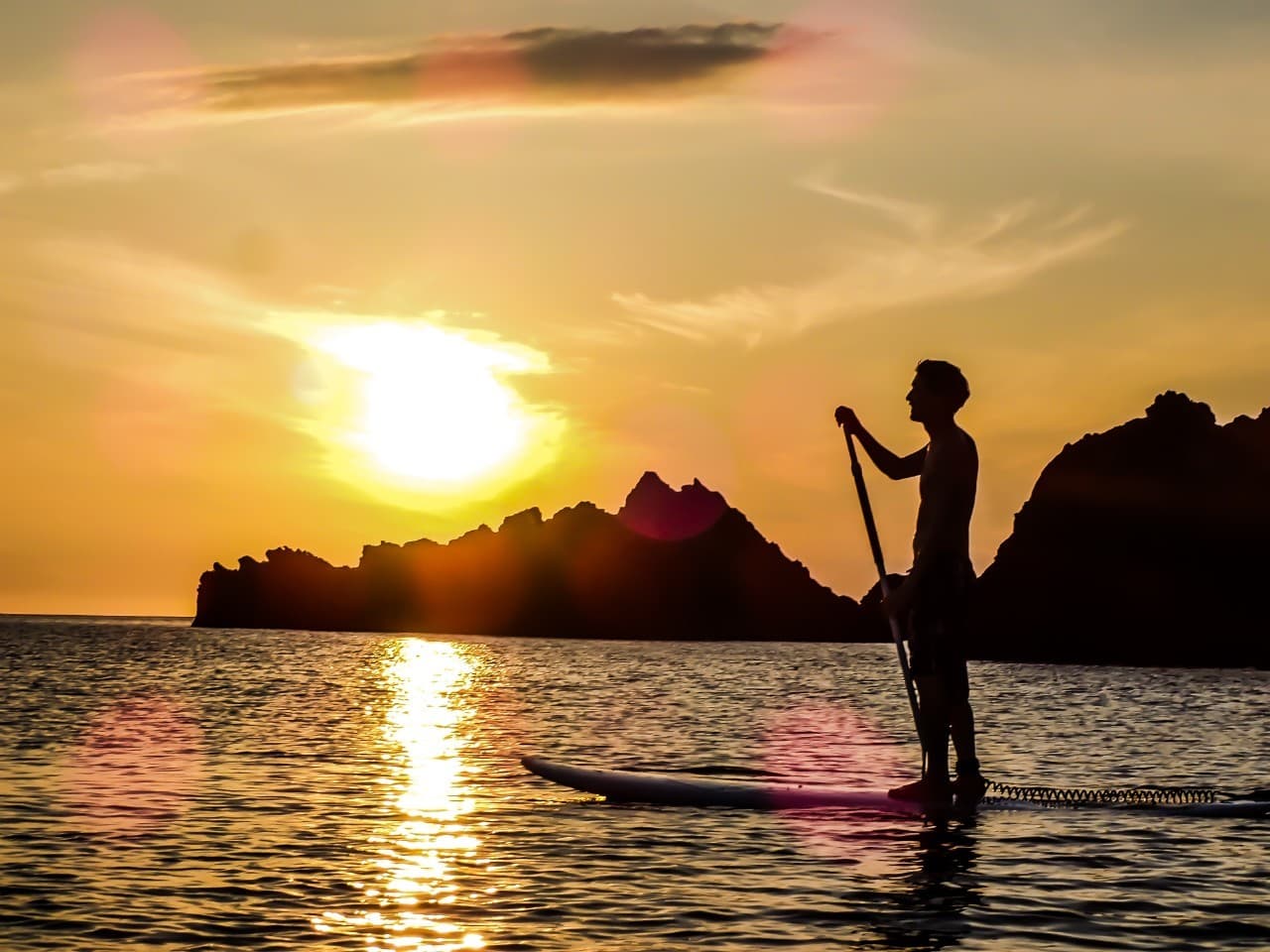 Marine activities (SUP board, sunset)