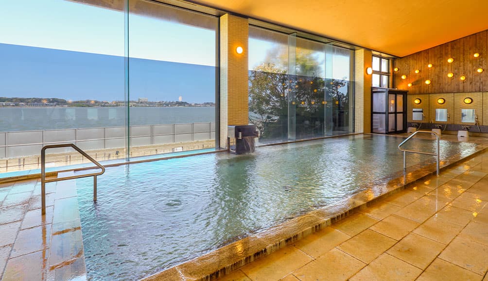 A Glass-Walled Bathhouse and Open-Air Bath