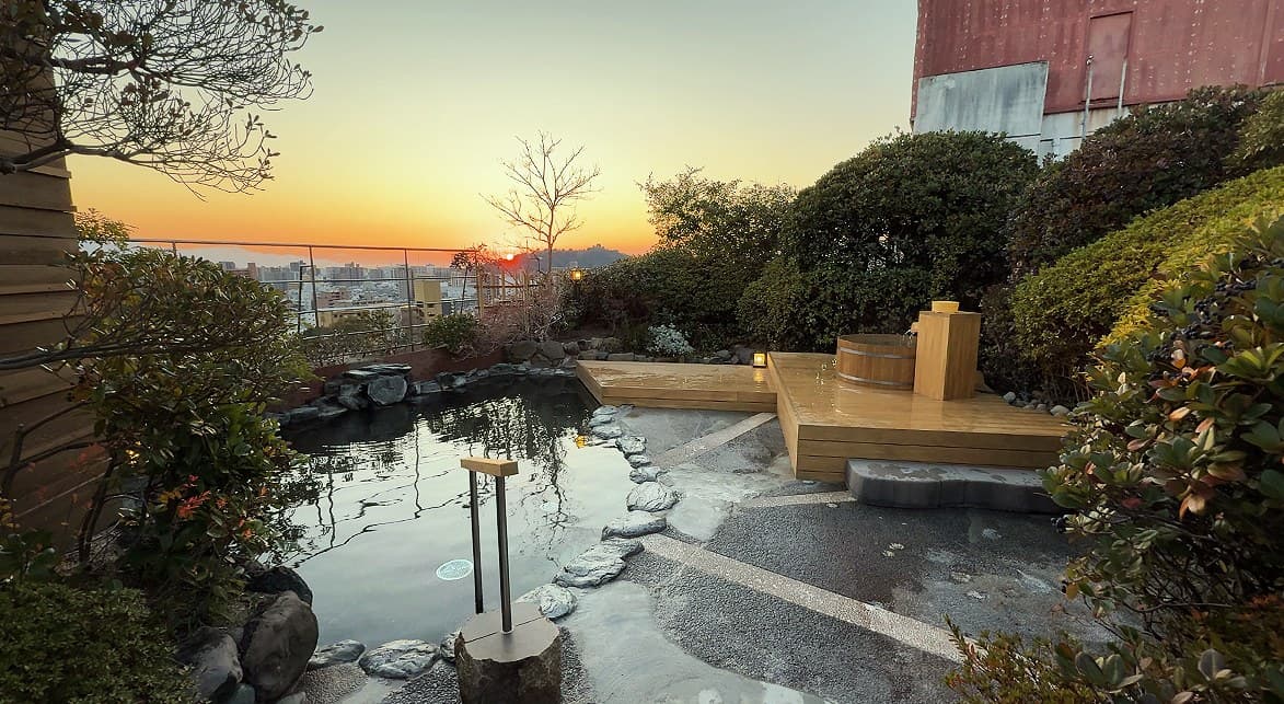 Dogo's famed waters in a rooftop open-air bath