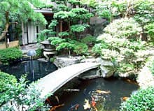 Atmosphere — a ryokan entrance with a garden