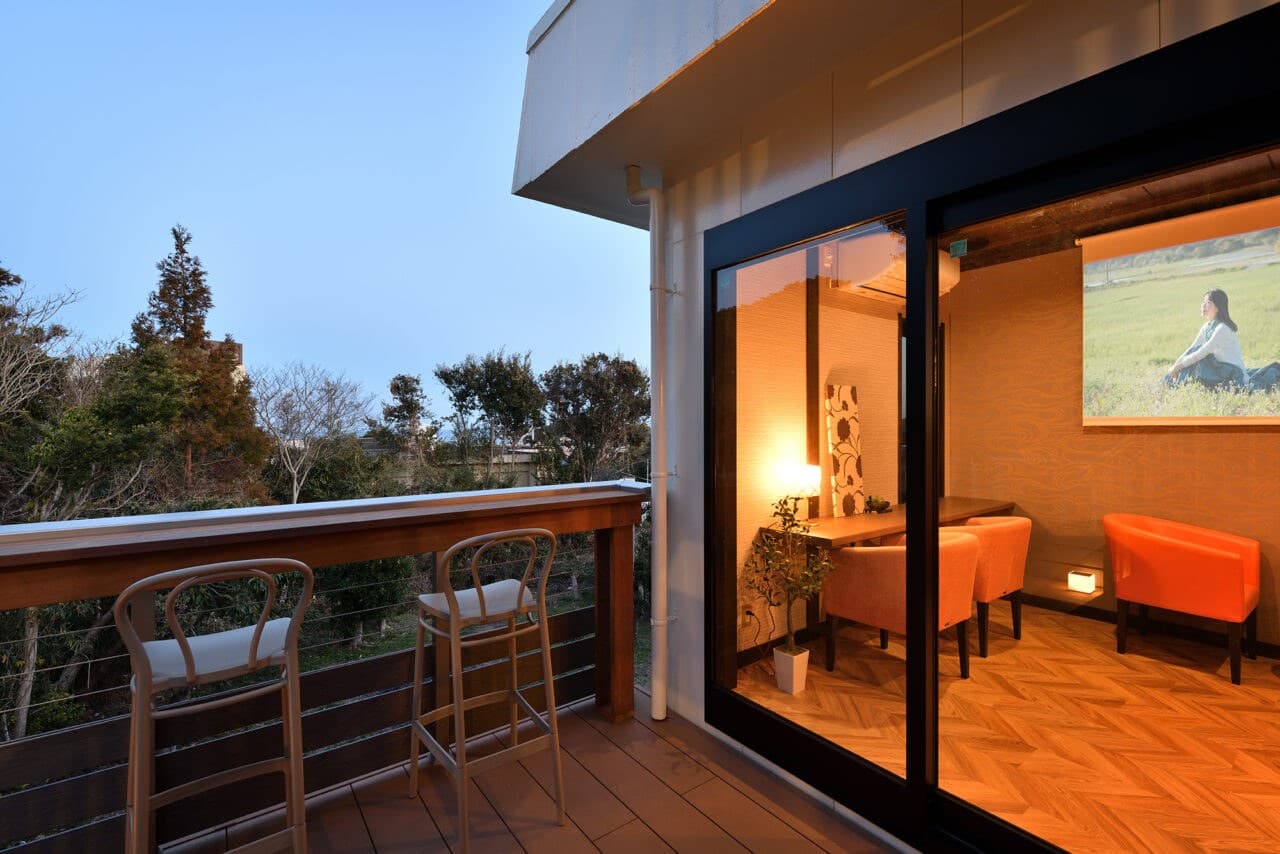 A Rooftop Terrace Under Falling Stars