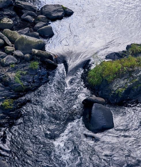 Held by mountains and a clear stream