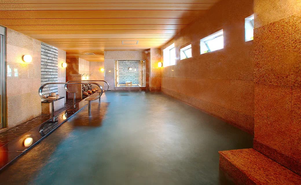 Open-air baths facing sea and temple