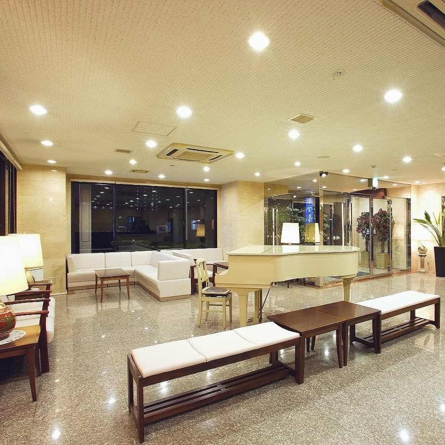 White grand piano lobby